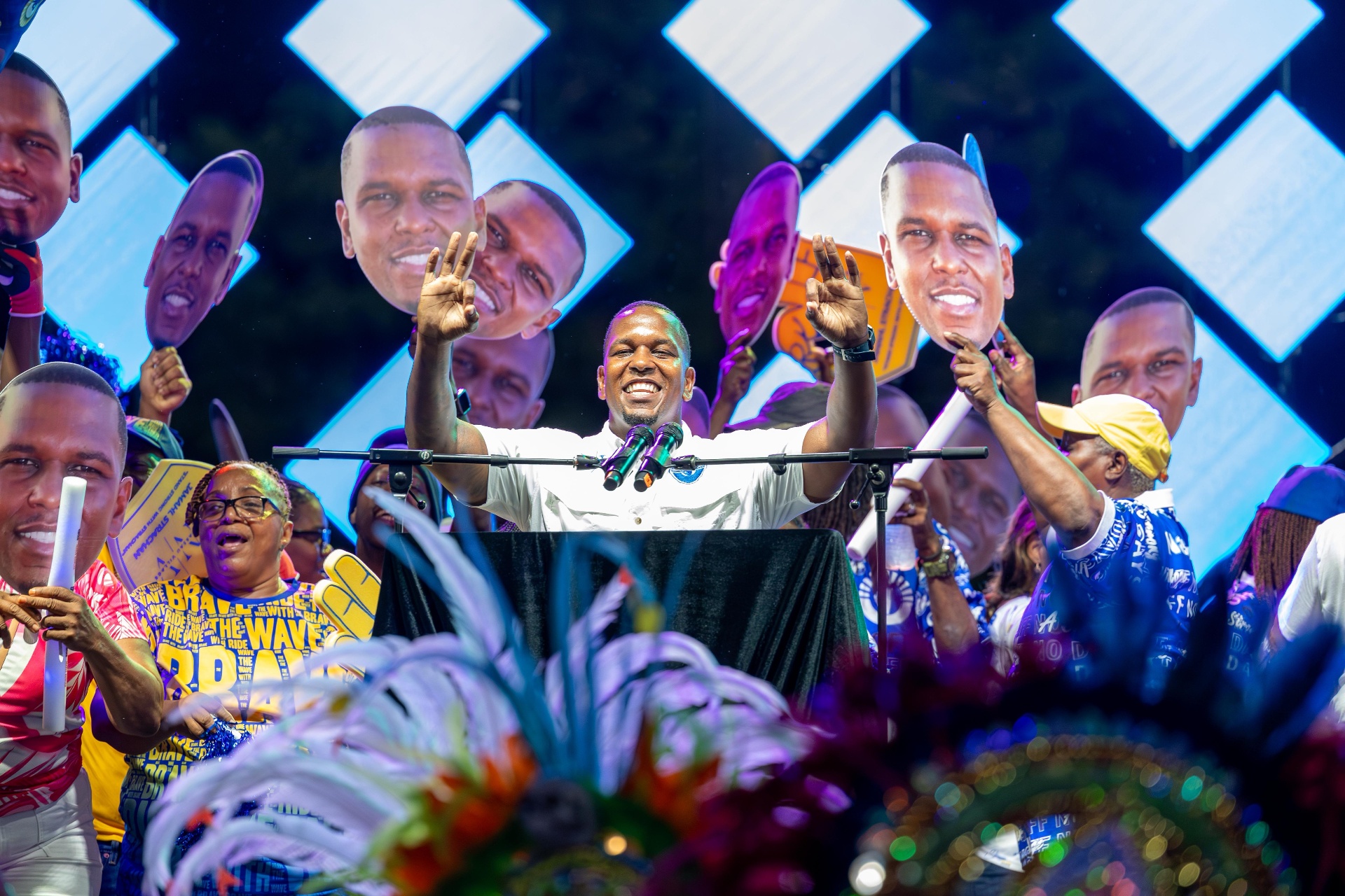 Jamahl Strachan greets supporters from the stage on nomination day