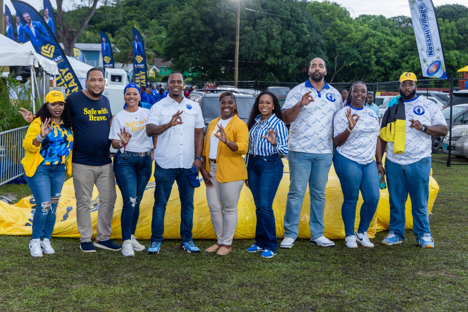 Strachan and campaign team posing together at the rally grounds